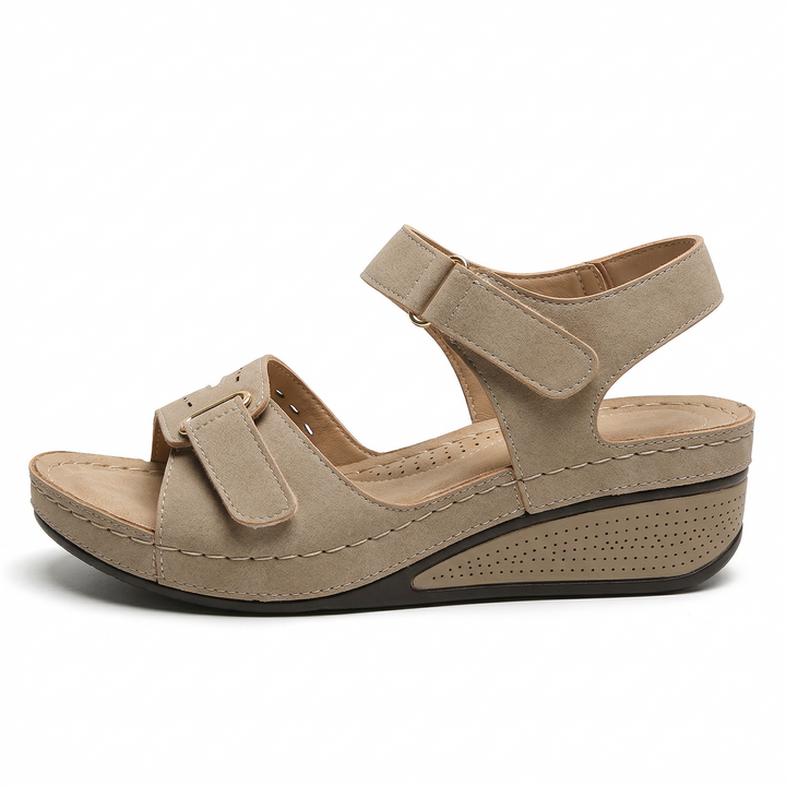 freepik_ultrahighresolution-studio-product-photo-of-a-womens-orthopedic-wedge-sandal-in-warm-beige-stone-tone-positioned-in-a-perfect-lateral-side-profile-angle-pure-white-background